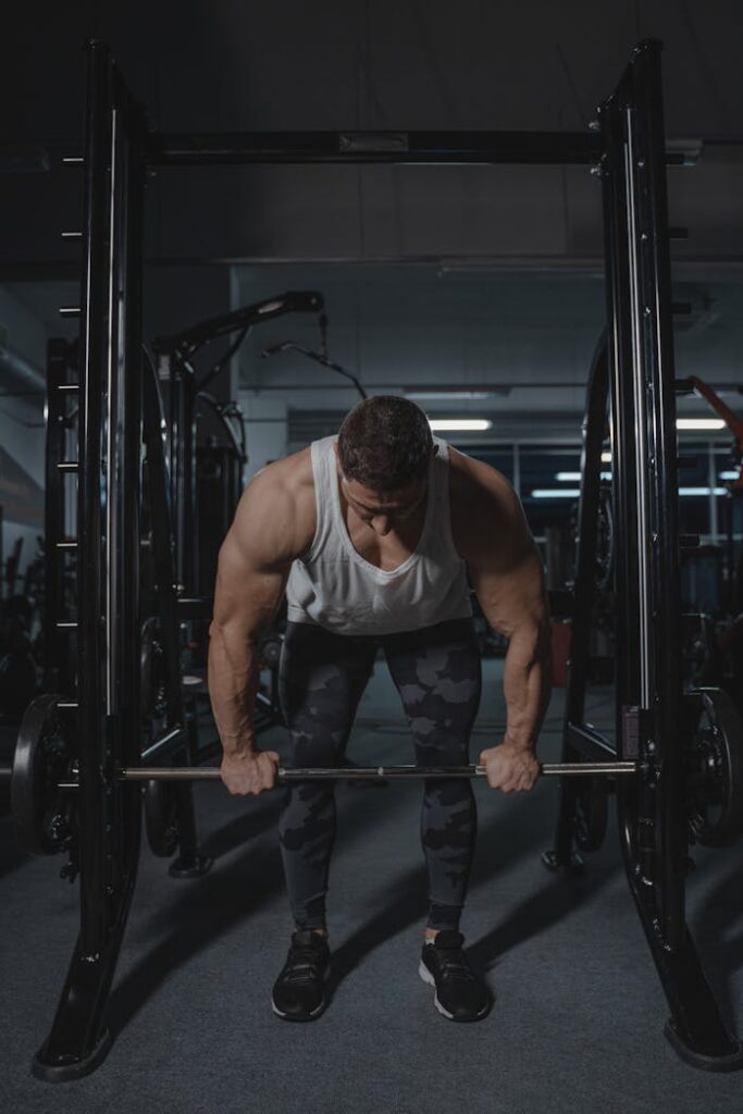 A Muscular Man Lifting a Barbell 